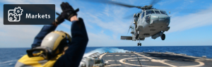 Helicopter landing on a naval vessel.