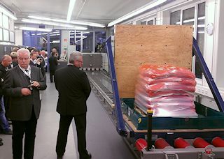 Crowd looking at Horizontal Impact Test System (HITS) in Fraunhofer's facility.