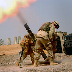 Mortar being fired by soldiers.